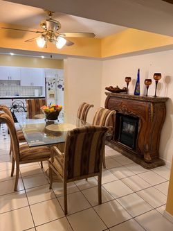 Glass Top Dining Table with 6 Chairs and Fire Place