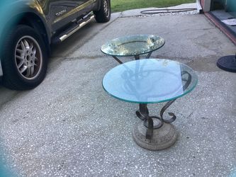 Glass top tables with rock bases