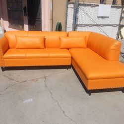 BRAND NEW 9X7FT AND 7X9FT SECTIONAL CHAISE, ORANGE LEATHER.  CUSTOM MADE AVAILABLE