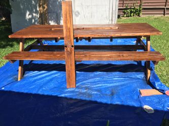 Picnic table with cooler in the center