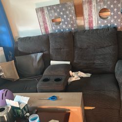 Couch with two recliners and center storage