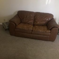Leather Love Seat And Chair With An Ottoman  