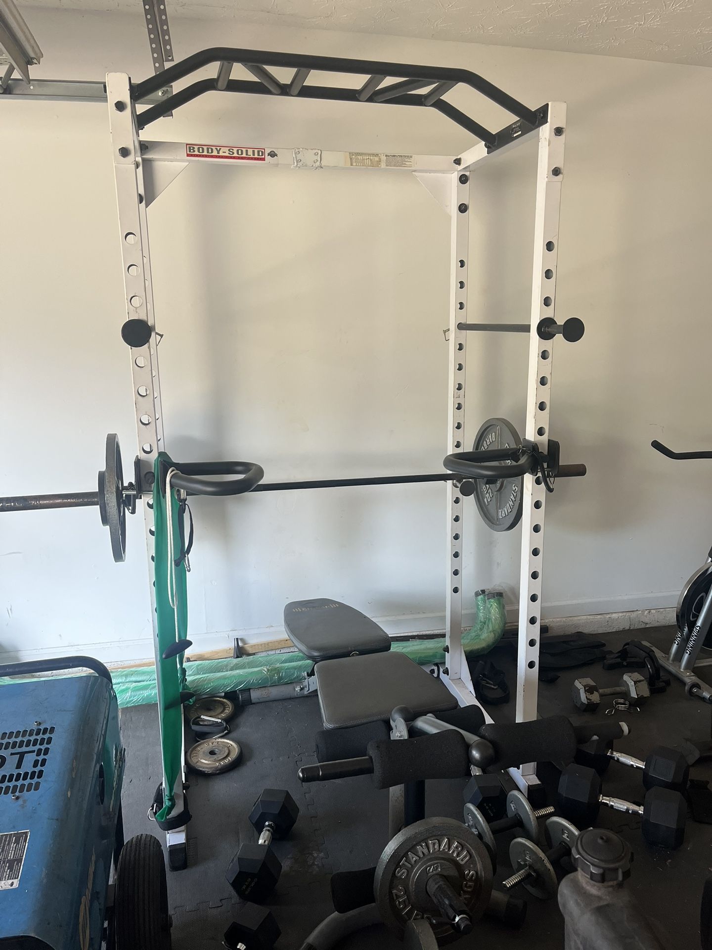 Squat rack with bench and dip bars