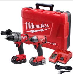 Milwaukee drill and impact kit new in plastic case new new 5.0 batteries