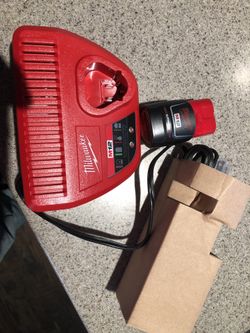 Brand new charger and 2.0 m12 battery