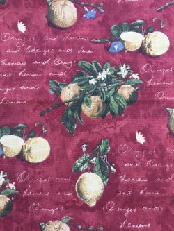 Fabric, brick or rust red background with lemons