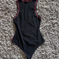 Women’s Alix NYC black sleeveless mock neck bodysuit size small pink stitching 