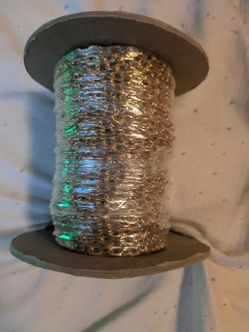Brand New 100' feet of Garland Chain Co. #803XL, marked BRASS, with a “Vibed” finish, and quantity 100— almost certainly a 100-foot factory spool. Gar