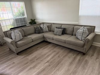 Beautiful gray studded sectional sofa