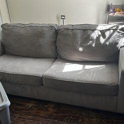light gray couch with matching loveseat 200 or best offer no stains just needs to be vacuumed.  moving