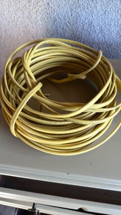 12-2 yellow NM-B solid copper electrical wire, commonly used for residential wiring.