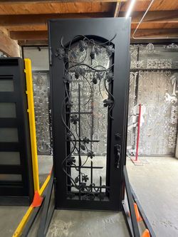 Wrought Iron Entry Door with Grape Vine Design 37x96 Liquidation Sale