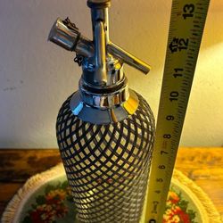 BOTELLA D GASIFICADA  DE CRISRAL FORRADA EN MALLA