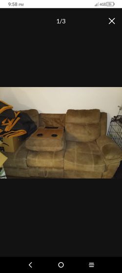 Double recliner sofa with central cup holder, pocket, and  charging port (USB and standard wall plug)  double