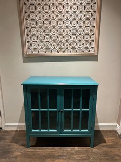 Teal book cabinet