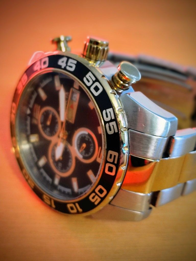 Invicta Tritnite Watch
Pro Drive, steel and gold plated, battery required