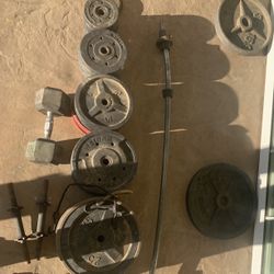 302.5 lbs standard/oly weights + dumbbells