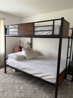 Full over full bunk bed with mattresses