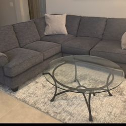 Sectional and glass table for sale.