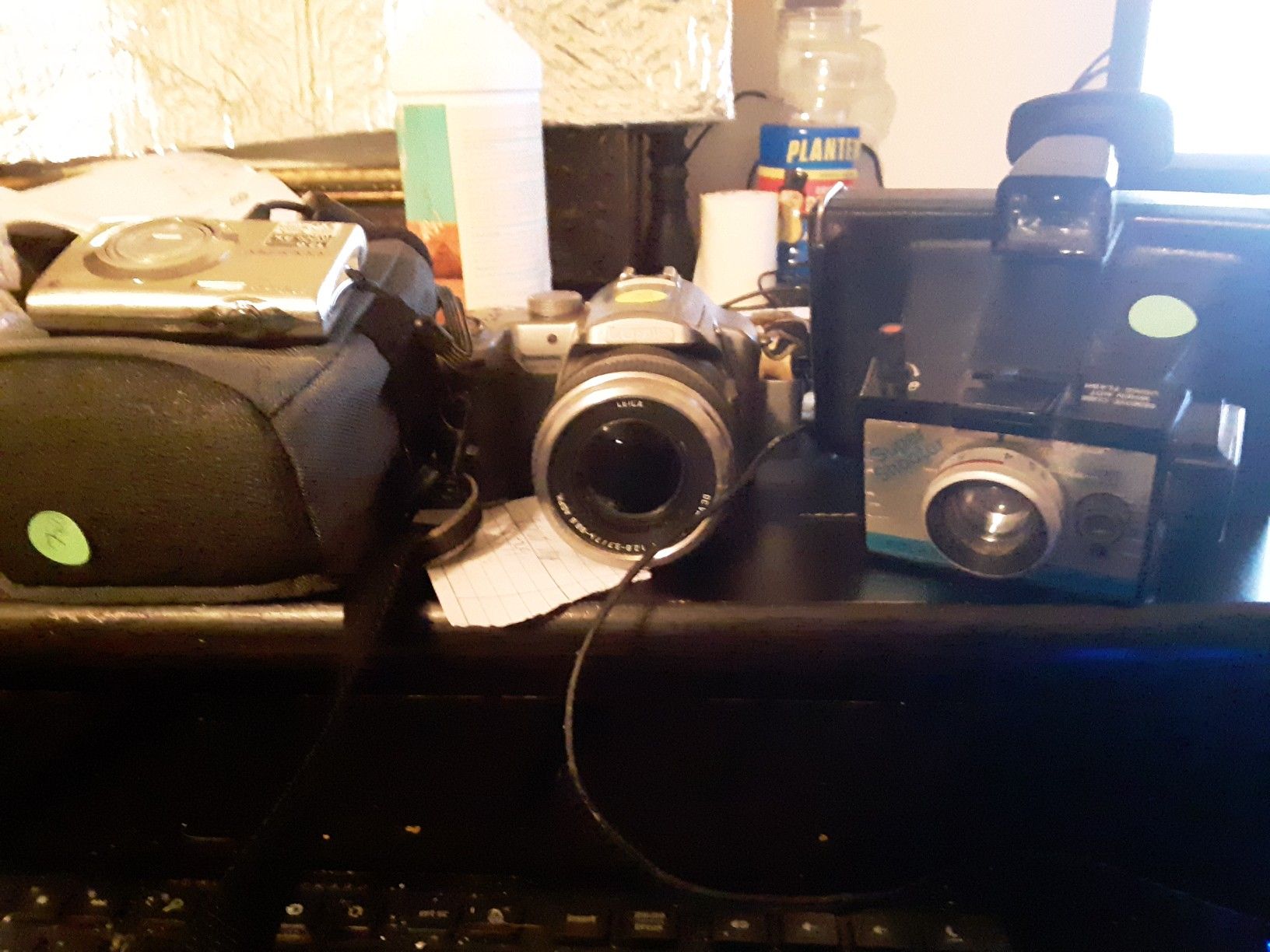 3 cameras Poloroid vintage Nikon coolpix Lumix