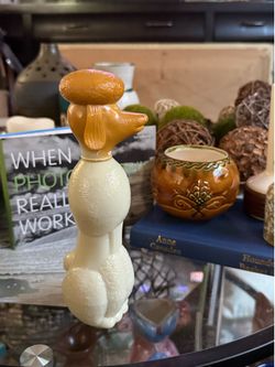 Vintage AVON Poodle Bird of Paradise Foaming Bath Oil Decanter - Empty   Vintage glass bottle is shaped like a poodle This collectible item has a text