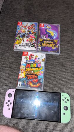 Nintendo Switch OLED (plus 3 games and extra joy cons)