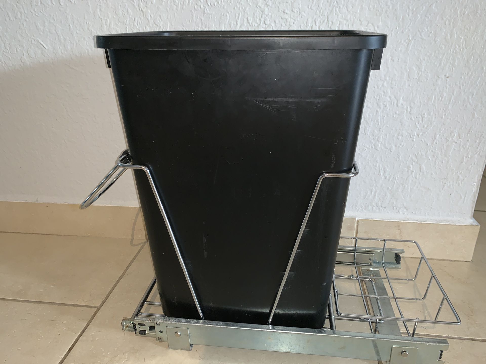 Waste container pullout for inside cabinet with storage shelf