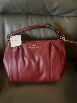 Brand New Coach crossbody purse in brick color,