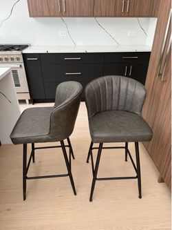 Two faux leather grey bar height, chair, chairs