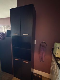 Tall Black Storage Cabinet with Gold Handles