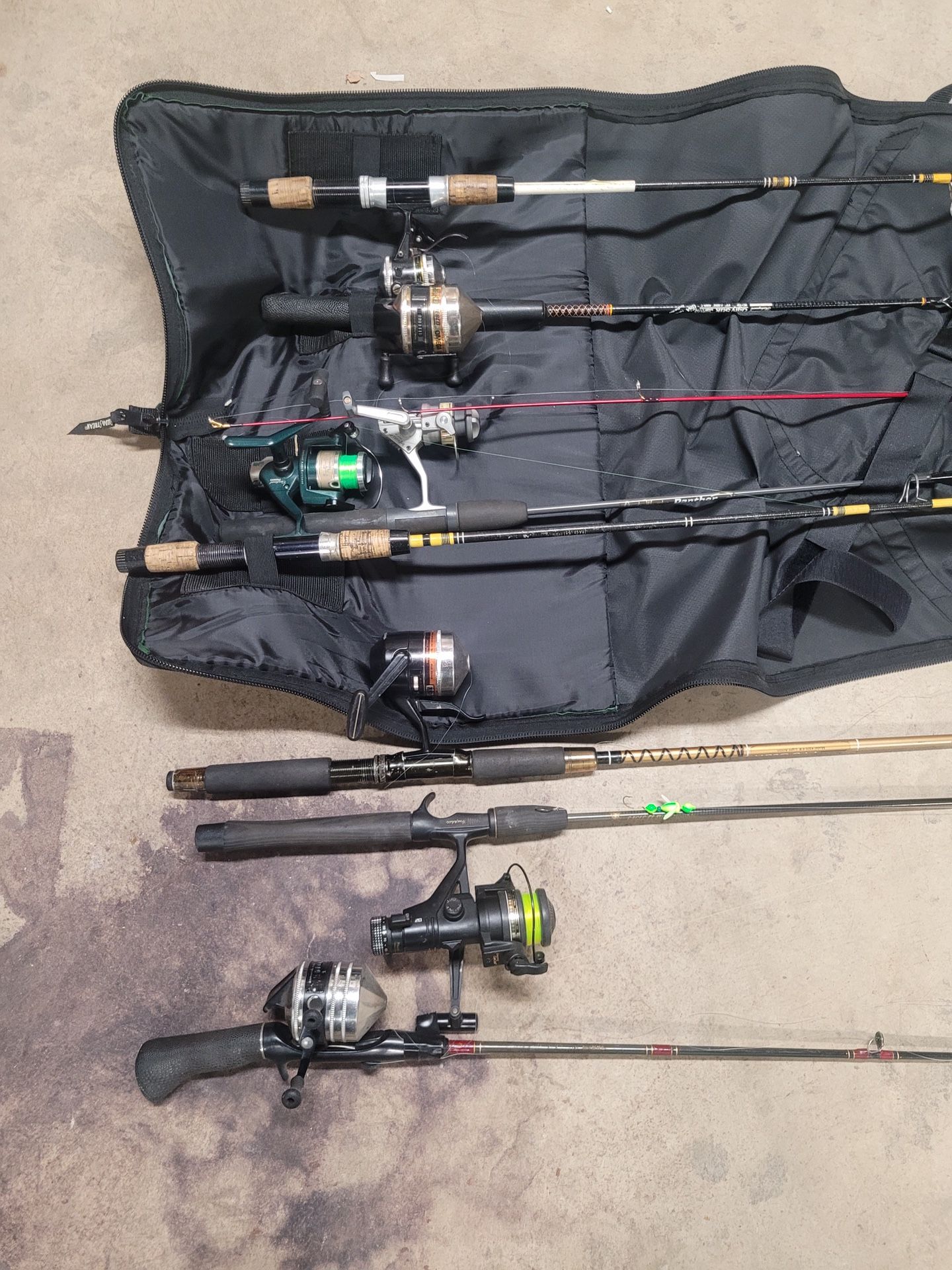 8 Fishing Rods And Reels And one Travel Bag