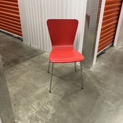 Four Red Stackable Chairs