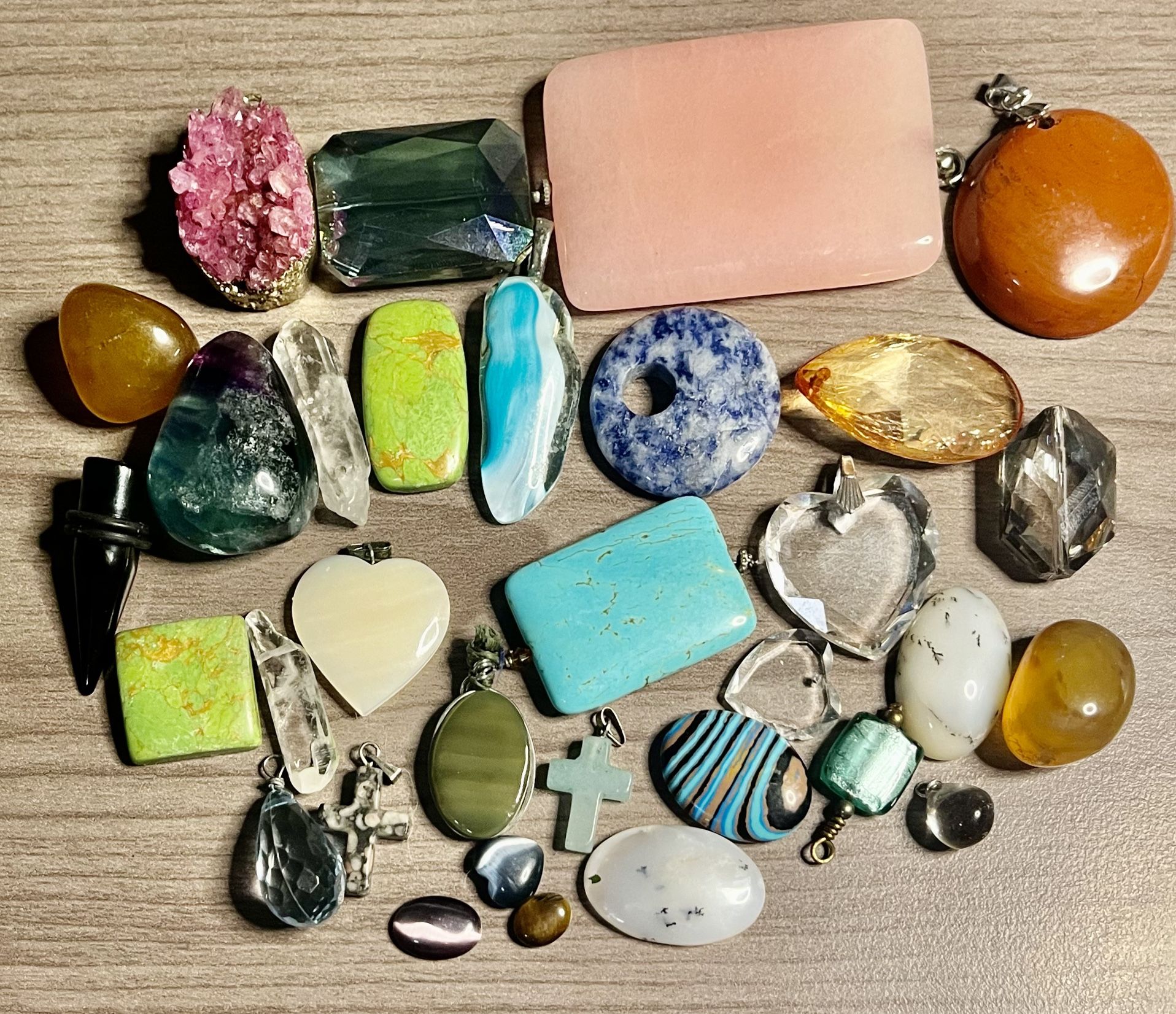Pretty stones, pendants and trinkets. All different colors and sizes. As is. No returns. Make me an offer I can’t refuse. Please feel free to ask any 