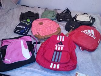 Different purses bags backpacks and more