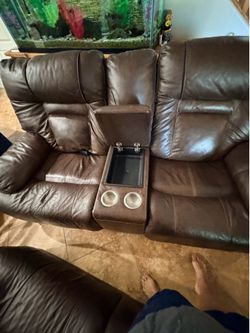 Brown leather couch and love seat