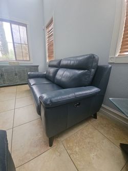 Living Spaces Moana Blue Leather Dual Power Reclining Sofa