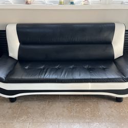 BLACK AND WHITE VINYL COUCH