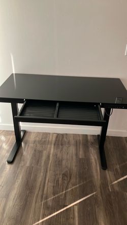 Black glass adjustable desk with charging port