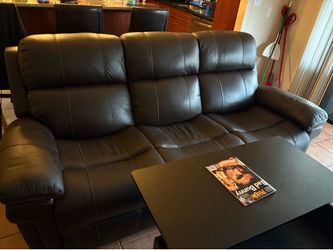 Leather couch with foot rest and leather love seat