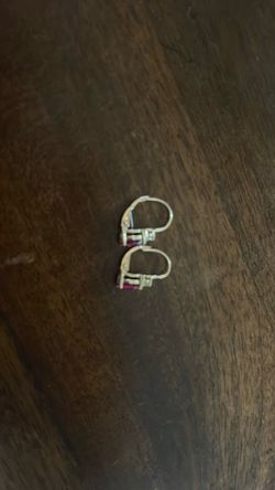 Earrings with a diamond and a ruby gem