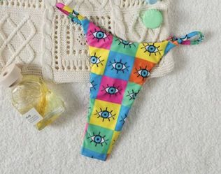 Multi-coloured eye print bikini bottoms #eyebikini Vibrant bikini bottom with eye print. Features blue, yellow, and pink squares. Perfect for a bold b