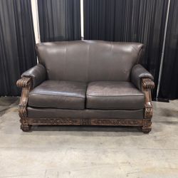 Dark Brown Leatherette Carved Wood Loveseat
