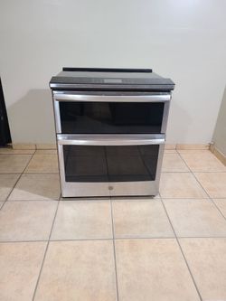 BEAUTIFUL GE Electric stove 5 burner, double conventional oven...