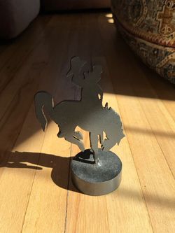 Metal cowboy on horse figurine flat