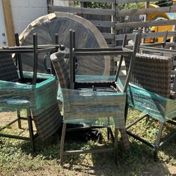 Outdoor Table + Chairs With Firepit In Middle