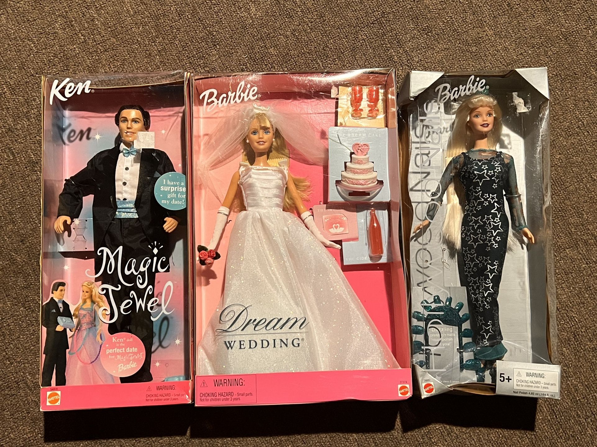 2 new Barbies and 1 new Ken. NEW