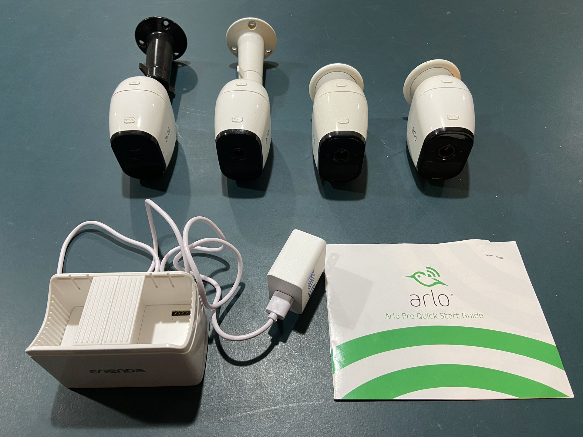 4 Arlo Pro Security Cameras, Plus Dual Charger