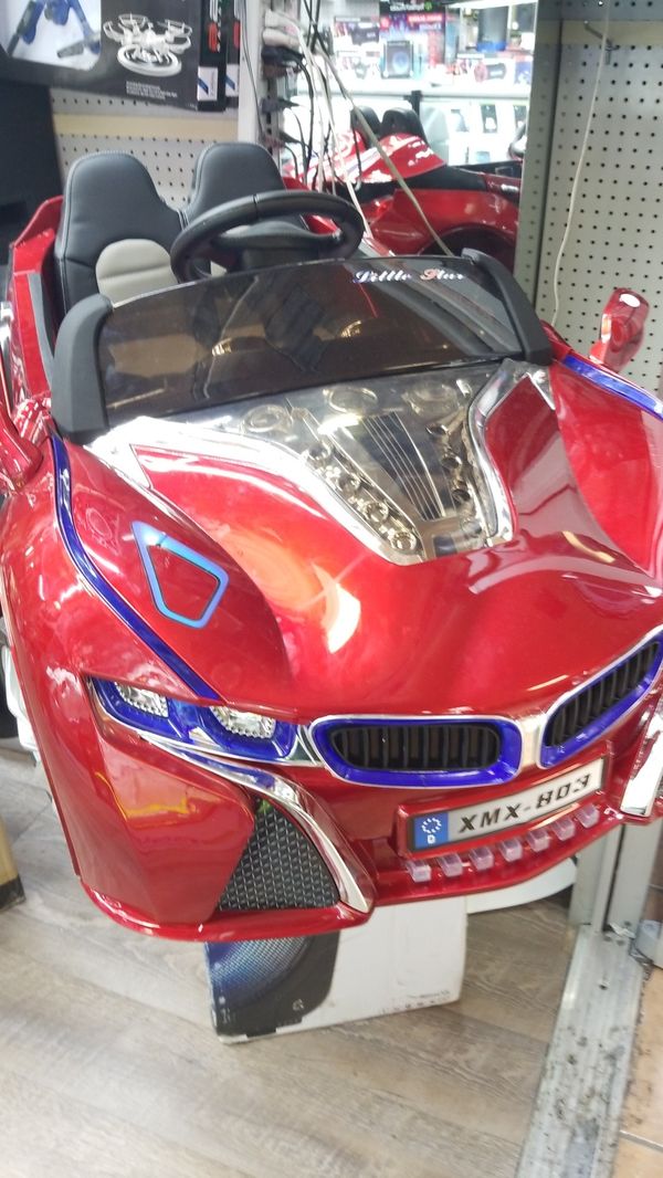 Kids ride on car with remote and lights and LCD with games Kids ride on car with remote and lights and LCD with games