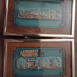 copper totem wall art designed by the artist Cleo Teissedre. These pieces are typically identified as "Teissedre Designs