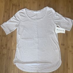 Athleta woman’s Breezy Tee. Size L. Light mauve. Super soft ,breathable with a draping fit. Covers your assets. Layers perfectly over tights. Throw in